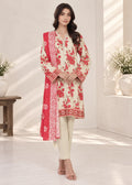 A woman modeling a traditional three-piece salwar kameez suit in a bright, modern indoor setting. The set features an off-white kurta with red floral prints and a red border, paired with a matching red dupatta and off-white trousers.