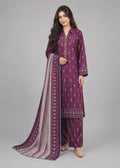 A woman modeling a three-piece traditional outfit consisting of a purple kurta with white motifs, matching purple pants, and a striped purple dupatta, set against a solid gray studio background.