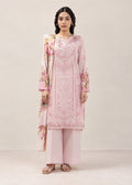 A woman modeling a light pink traditional outfit with floral embroidery and matching wide-leg trousers against a plain beige studio background.