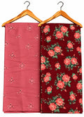 Two folded fabric pieces hanging on wooden hangers against a white background. The left fabric is dusty pink with small embroidered floral motifs, and the right fabric is dark red with a larger rose floral print.