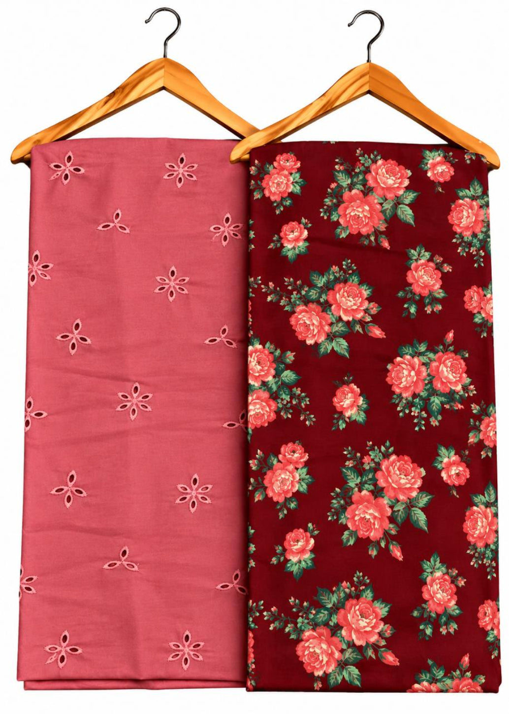 Two folded fabric pieces hanging on wooden hangers against a white background. The left fabric is dusty pink with small embroidered floral motifs, and the right fabric is dark red with a larger rose floral print.
