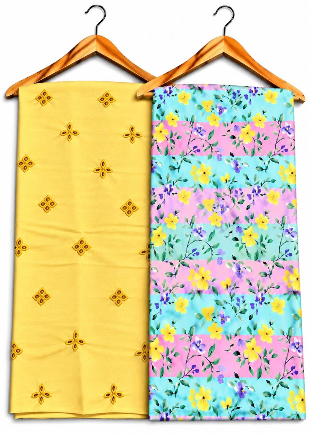 Two folded fabric pieces hanging on wooden hangers against a white background. The left fabric is pale yellow with small embroidered floral motifs.