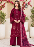 A woman models a traditional three-piece beige ethnic suit with brown floral embroidery and a matching dupatta, set against a beige wooden grid wall background.