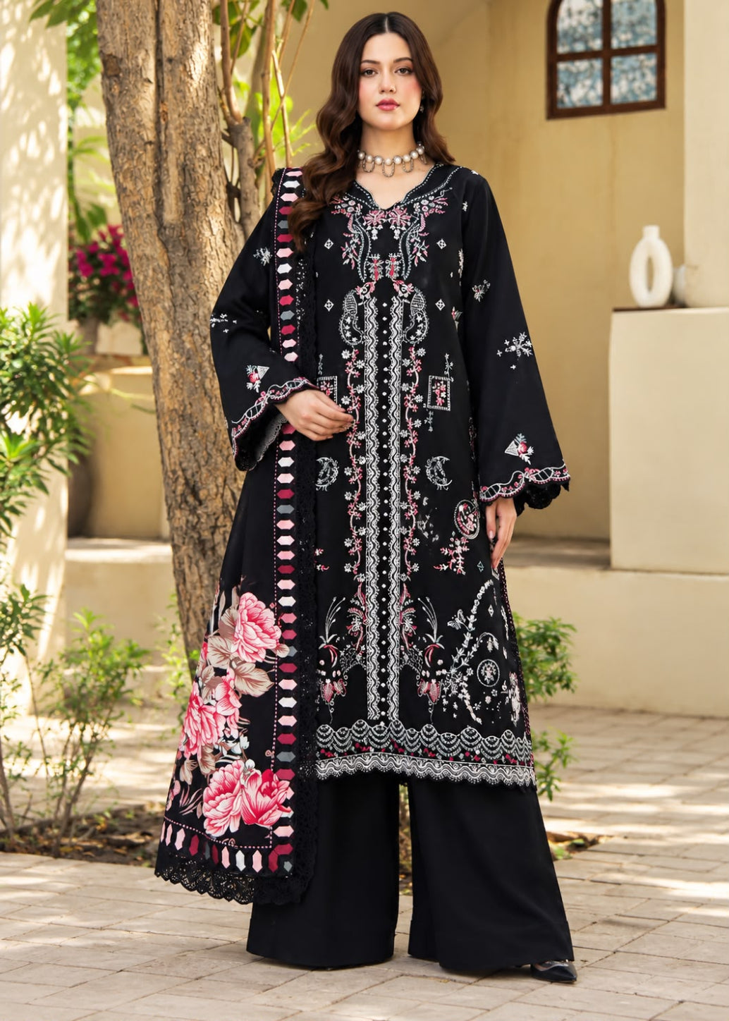 A woman models a traditional three-piece beige ethnic suit with brown floral embroidery and a matching dupatta, set against a beige wooden grid wall background.