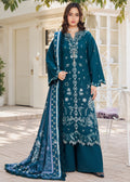 A woman models a traditional three-piece beige ethnic suit with brown floral embroidery and a matching dupatta, set against a beige wooden grid wall background.