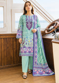 A woman stands on a boat deck wearing a mint green three-piece traditional outfit with purple and pink floral embroidery and prints, paired with matching pants and a dupatta.