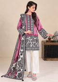 A woman models a traditional South Asian outfit consisting of a pink and black printed kurta, white trousers, and a matching printed dupatta, set against a neutral indoor background.