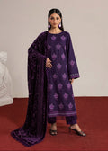 A woman models a deep purple three-piece traditional outfit with matching embroidered kurta, pants, and a textured dupatta, set against a minimalist beige wall and red carpet.
