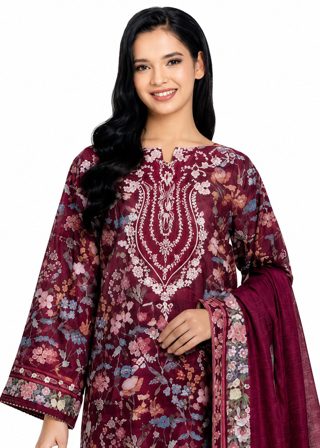A woman modeling a traditional Indian salwar kameez set in deep maroon, featuring a floral print in pink, blue, and green, with white embroidery on the chest and a matching dupatta.