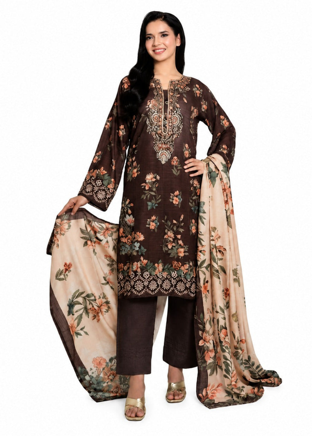 A woman modeling a traditional Indian salwar kameez suit set. The set features a dark brown long-sleeve tunic with intricate floral embroidery and a matching floral dupatta in beige, paired with dark brown trousers.