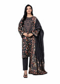A woman modeling a traditional Indian salwar kameez suit with a black base and intricate multicolor floral embroidery, paired with a matching black dupatta, on a solid white background.