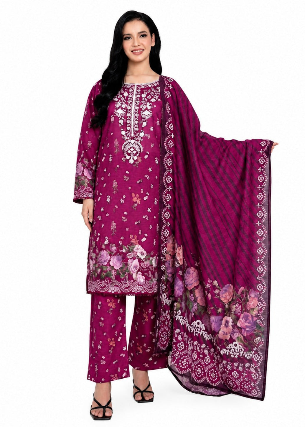 A woman modeling a magenta three-piece salwar kameez suit with floral prints and a matching dupatta, set against a plain white background.