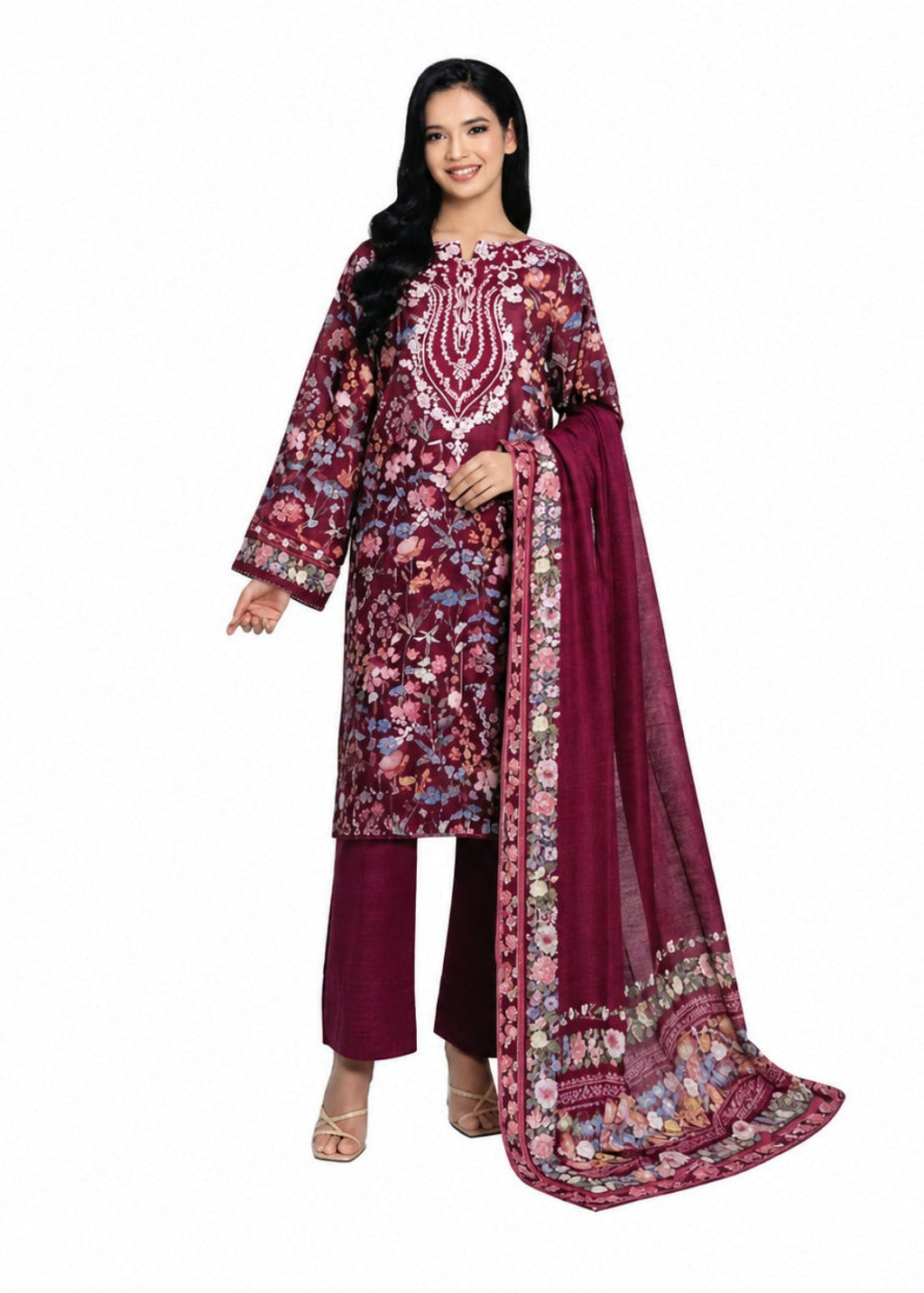 A woman modeling a traditional Indian salwar kameez suit in deep maroon with intricate multicolor floral embroidery, paired with matching maroon trousers and a sheer maroon dupatta with a floral border, set against a plain white background.