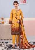 A woman models a three-piece Indian ethnic salwar kameez suit set. The set features a mustard yellow kurta with a brown and orange floral gradient print, matching yellow trousers, and a coordinating dupatta with a brown border and floral print.