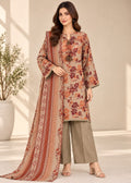 A woman models a traditional three-piece salwar kameez set. The set features a beige tunic (kameez) with a rust-orange and brown floral print, olive green wide-leg pants, and a matching dupatta with a rust-orange geometric pattern.