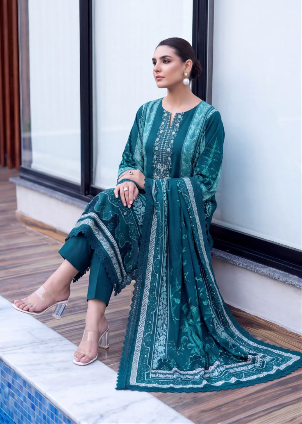 A woman modeling a teal green embroidered traditional outfit with matching pants and dupatta, shown in a split portrait and full-body pose on a modern balcony.