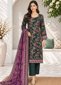 A woman models a dark green floral salwar kameez suit with a purple printed dupatta, standing in a bright, modern courtyard setting.