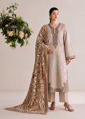 A woman models a traditional South Asian salwar kameez suit in beige and brown. The outfit features an embroidered beige kameez kurta with a matching brown patterned dupatta draped over her shoulder, paired with beige trousers.