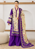 A woman models a traditional South Asian three-piece salwar kameez suit. The set features a deep purple kurta and matching wide-leg trousers, paired with a beige kameez jacket and dupatta heavily decorated with purple borders and floral embroidery.