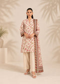 A woman modeling a cream-colored floral kurta with pink and green floral patterns, featuring wide sleeves with striped and geometric borders, paired with a matching patterned dupatta.