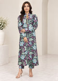 A woman models a long-sleeved, high-neck maxi dress with a colorful floral and leaf pattern in purple, green, and light blue, styled with matching cropped pants and beige high-heeled sandals.