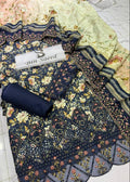 A folded and draped navy blue floral salwar suit fabric set with matching printed dupatta and a rolled fabric piece, displayed on a light tiled floor. A white label reading 'Bin Saeed' is placed on top.