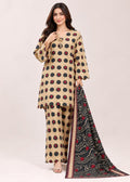 A woman modeling a beige three-piece salwar kameez suit with black and red polka dots, paired with a black dupatta featuring red and white wave patterns, set against a plain light beige background.