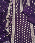 Purple velvet ethnic salwar suit material set featuring a kurta with silver mirror work embroidery, matching trousers, and a dupatta.