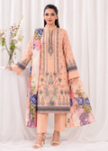 A woman models a peach-colored traditional three-piece salwar kameez suit with floral prints and detailed embroidery, paired with peach trousers and beige heels, set against a white draped background.
