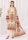 A woman models a traditional South Asian salwar kameez suit set featuring a cream-colored kurta and trousers with intricate multicolor geometric embroidery, paired with a matching dupatta.