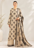 A woman models a traditional beige and black printed ethnic outfit with a long kurta, wide-leg pants, and a matching dupatta, set against a softly lit neutral studio background.