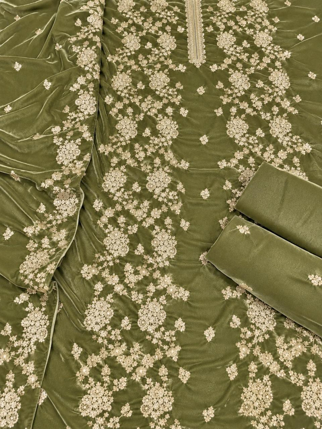 Olive green fabric with beige floral embroidery and a matching rolled fabric piece, shown in a close-up product shot.