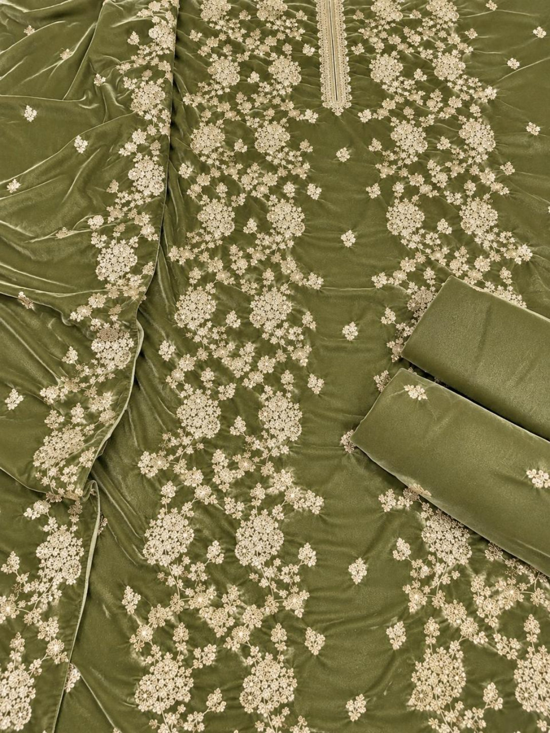 Olive green fabric with beige floral embroidery and a matching rolled fabric piece, shown in a close-up product shot.